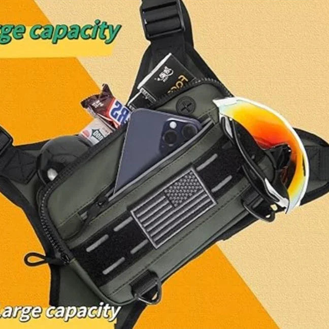 Black tactical waist bag with American flag patch, holding phone, sunglasses, and energy bars