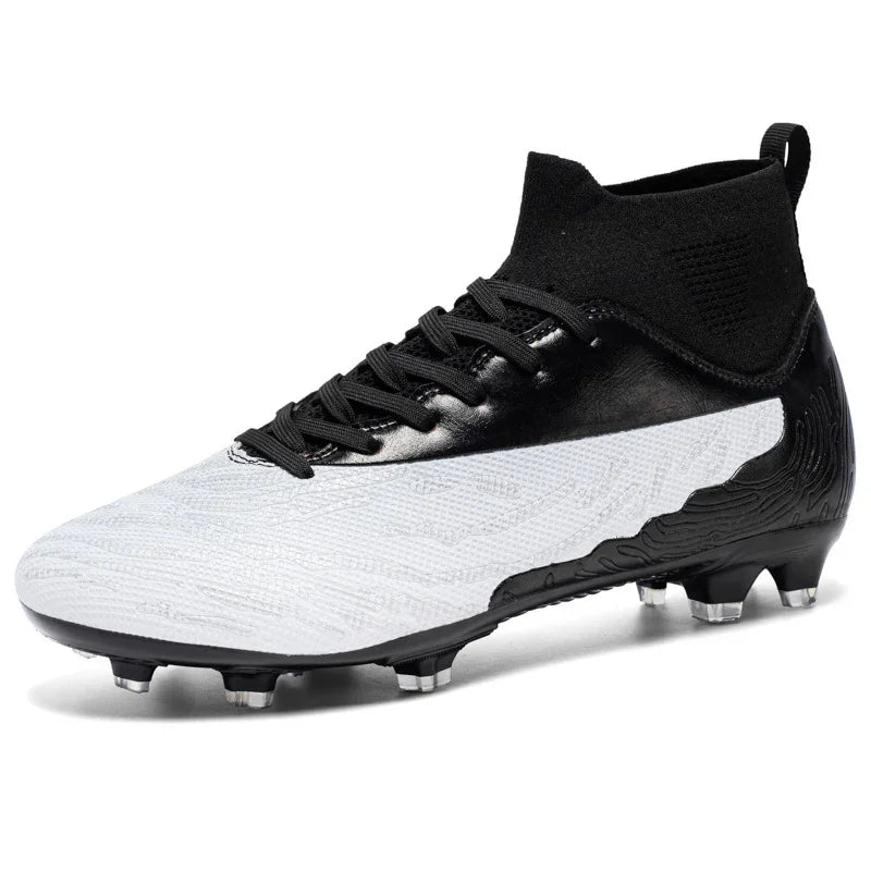 Black and white modern soccer cleat with high ankle knit collar and studded outsole