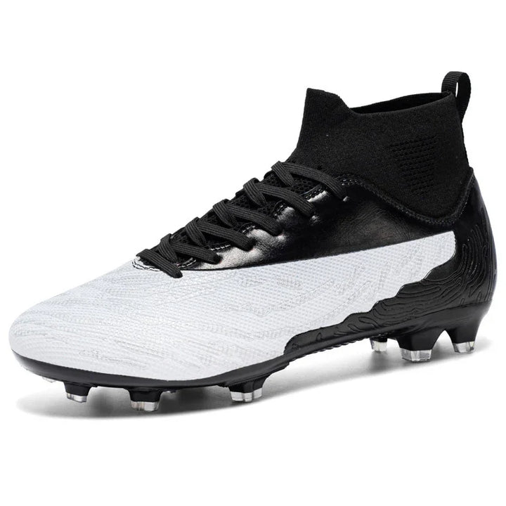Black and white modern soccer cleat with high ankle knit collar and studded outsole