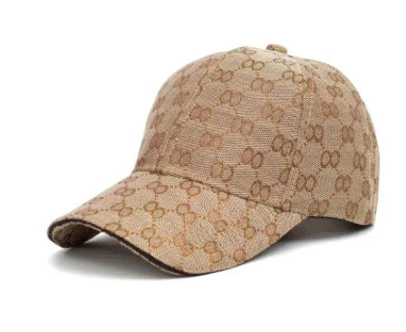 Beige designer baseball cap with interlocking double-G logo pattern
