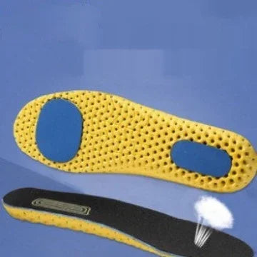 Yellow perforated shoe insoles with blue cushioned heel and arch support pads on a blue background