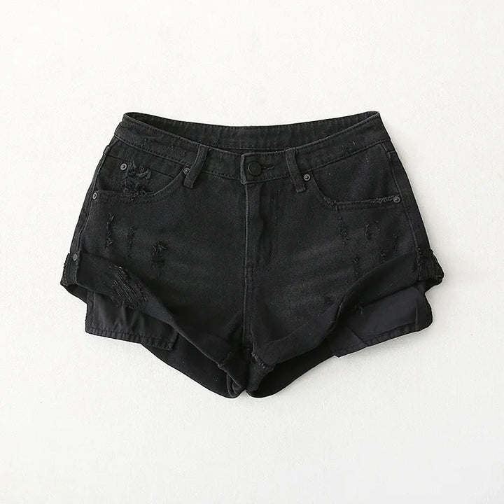 Black distressed denim shorts with frayed hem and rolled cuffs on white background