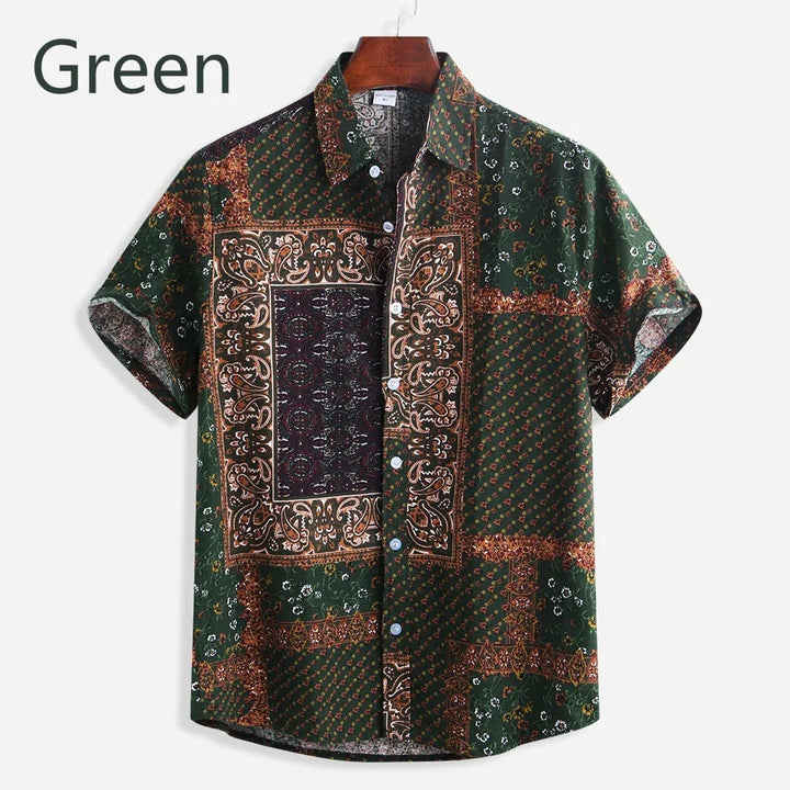 Green short-sleeve button-up shirt with intricate paisley and floral patchwork design