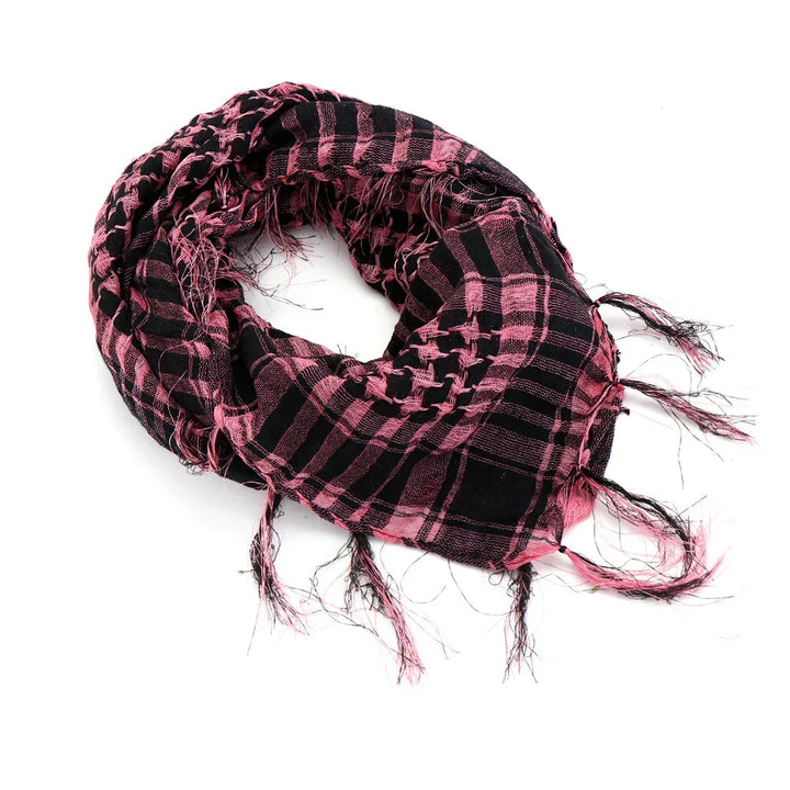 Pink and black checkered keffiyeh scarf with fringed edges on white background