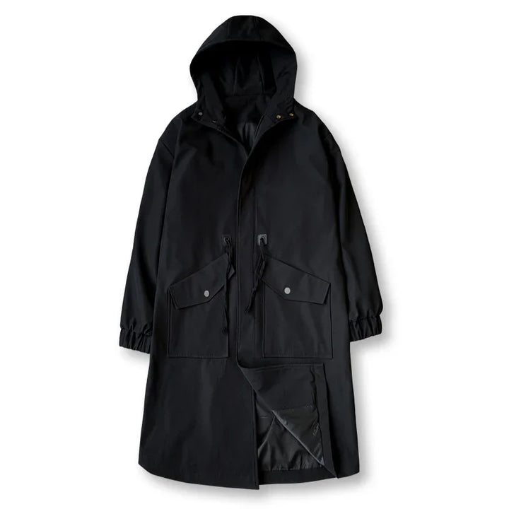 Black long hooded raincoat with front flap pockets and drawstring waist on white background