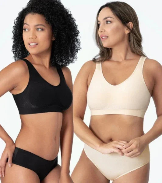Two women modeling comfortable wireless bras and matching underwear in black and beige against white background