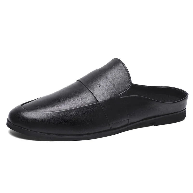 Black leather slip-on mule shoe with a rounded toe and flat sole
