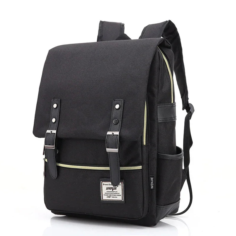 Black canvas backpack with front flap, buckles, side pocket, and zipper details