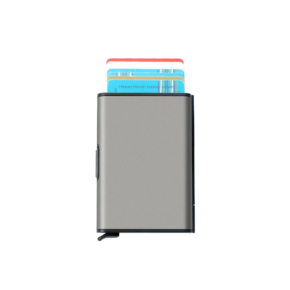 Silver metal card holder wallet with credit cards partially extended on white background