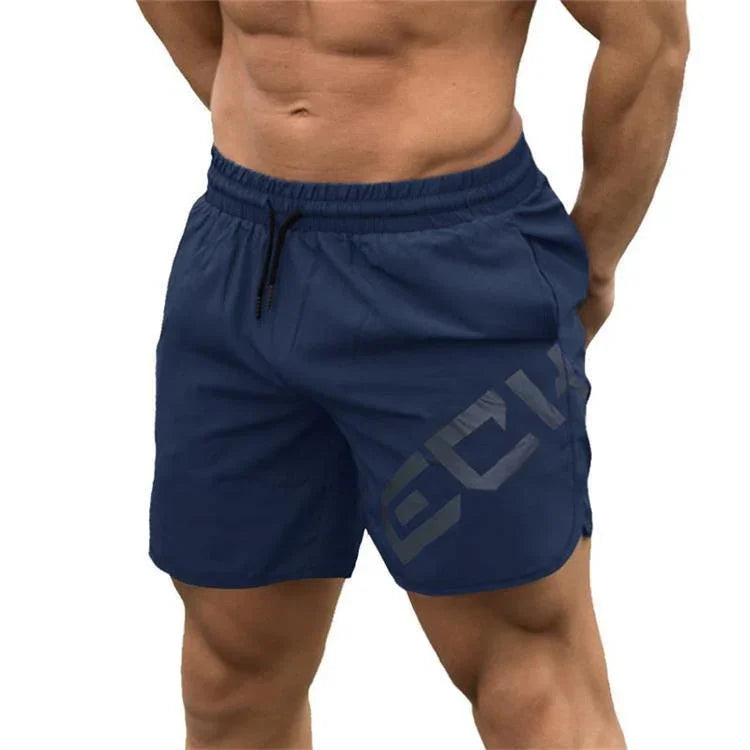Man wearing navy blue athletic shorts with drawstring and side logo, fitness apparel
