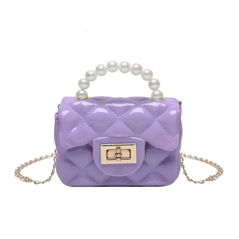 Lavender quilted handbag with glossy finish, pearl handle, gold twist-lock clasp, and chain strap