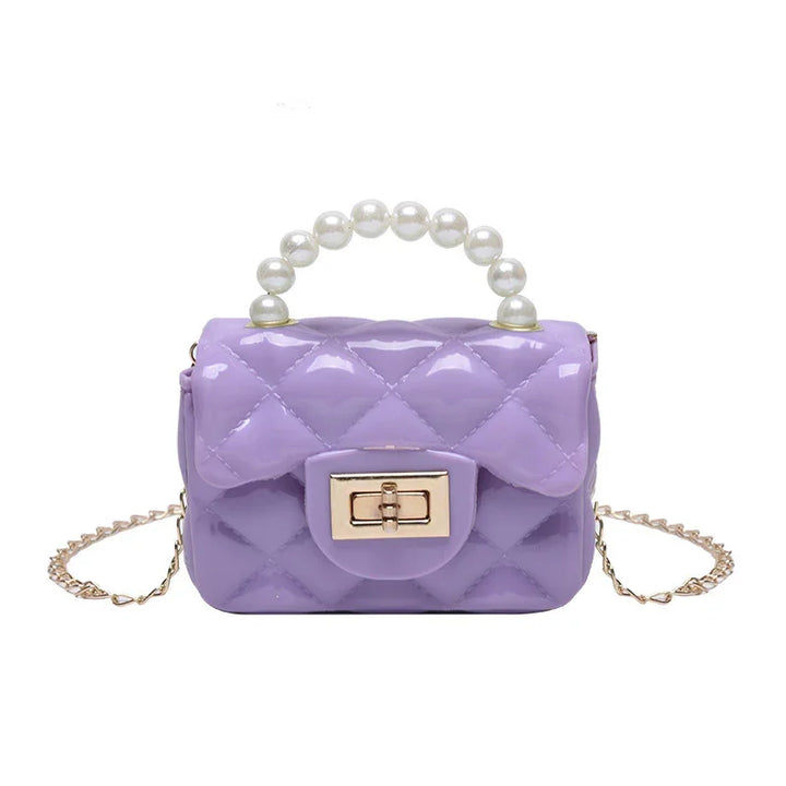 Lavender quilted handbag with glossy finish, pearl handle, gold twist-lock clasp, and chain strap