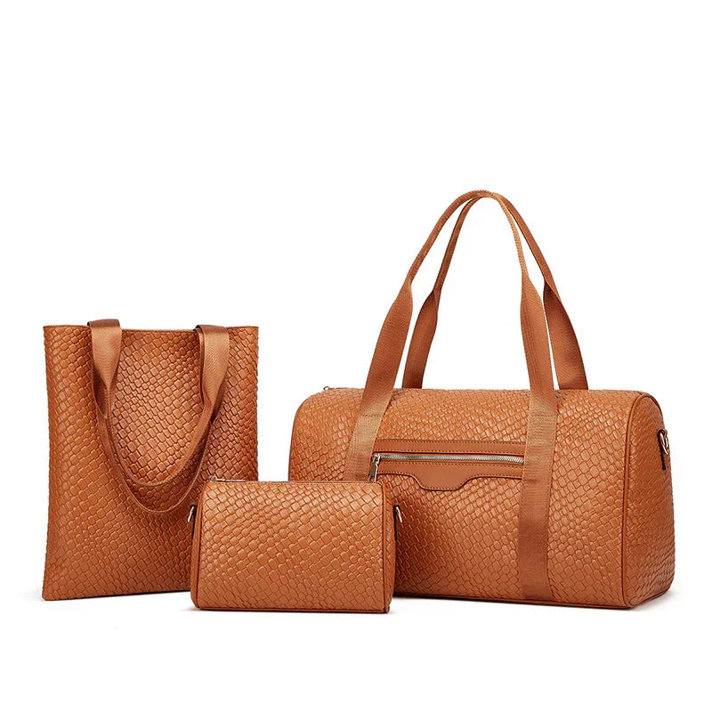 Three-piece brown leather travel bag set with textured pattern including tote, duffel, and clutch bags