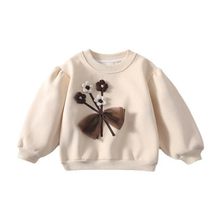 Cream toddler sweatshirt with puff sleeves and brown and white flower appliques with bow detail