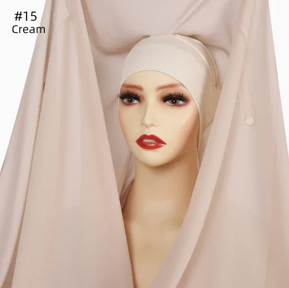 Cream-colored hijab fabric displayed on mannequin with makeup, labeled #15 Cream