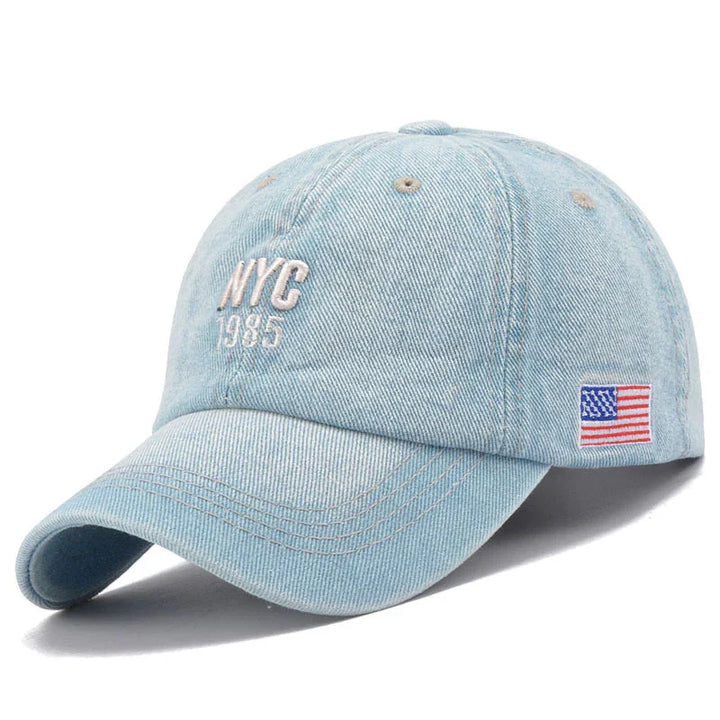 Light blue denim baseball cap with NYC 1985 embroidery and small American flag patch