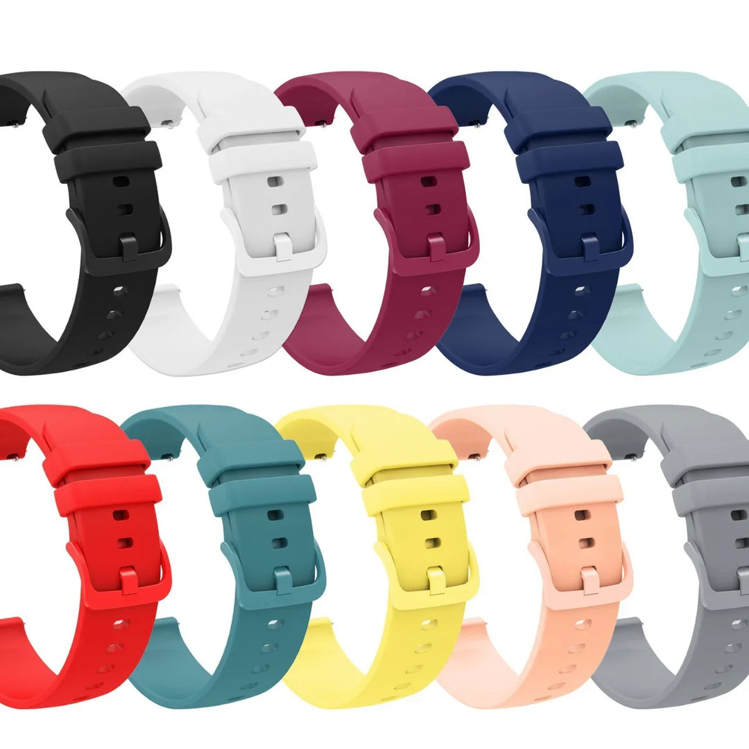 Collection of colorful silicone watch bands in black, white, red, blue, yellow, and gray