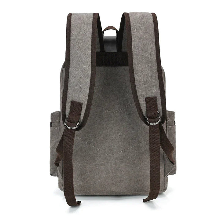 Gray canvas backpack with brown adjustable shoulder straps and side pockets