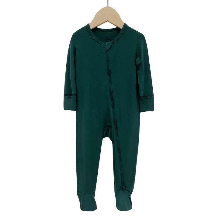Dark green long-sleeve baby onesie with footies and front zipper on wooden hanger