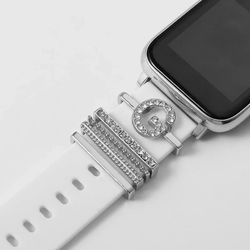White smartwatch band with silver and crystal decorative charms including a rhinestone letter G