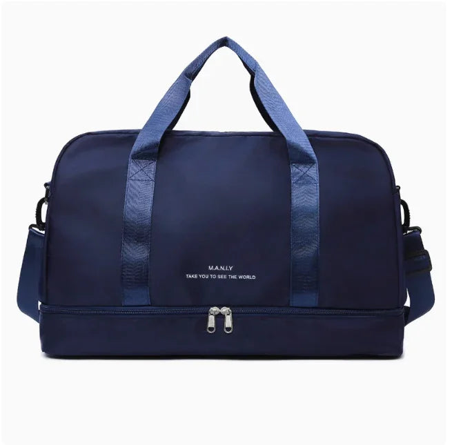 Navy blue travel duffel bag with MANLY logo and adjustable shoulder strap