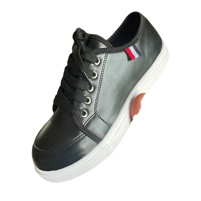 Black leather sneaker with white rubber sole and red, white, and blue fabric detail on side