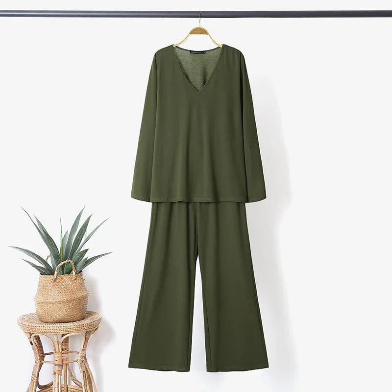 olive green long sleeve V-neck top and wide leg pants set hanging on wooden hanger