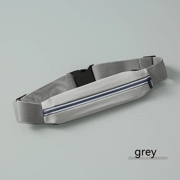 Grey running belt with zipper pocket and adjustable strap on light grey background