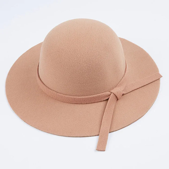 Beige wide-brim felt hat with a decorative knot band on a white background