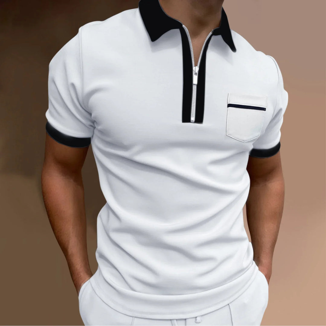 Man wearing white short-sleeve polo shirt with black collar, zipper, pocket trim, and sleeve cuffs