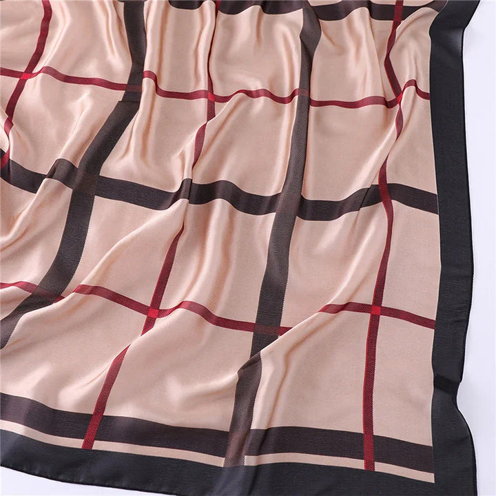 Beige silk scarf with black and red plaid pattern and black border