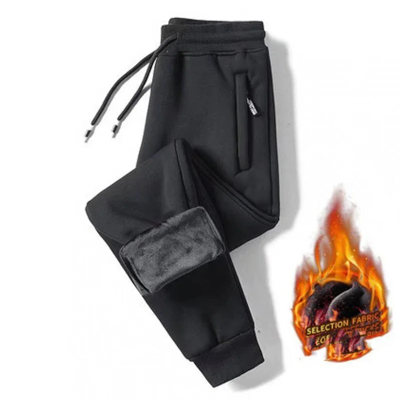 Black fleece-lined jogger pants with zippered pocket and adjustable drawstrings on white background
