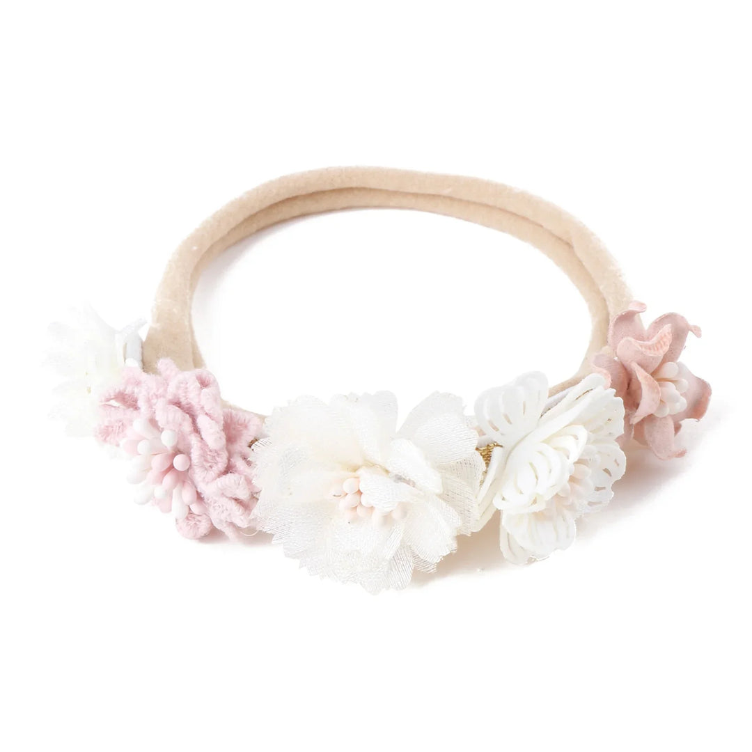 Soft beige headband with delicate fabric and yarn flowers in white and pale pink