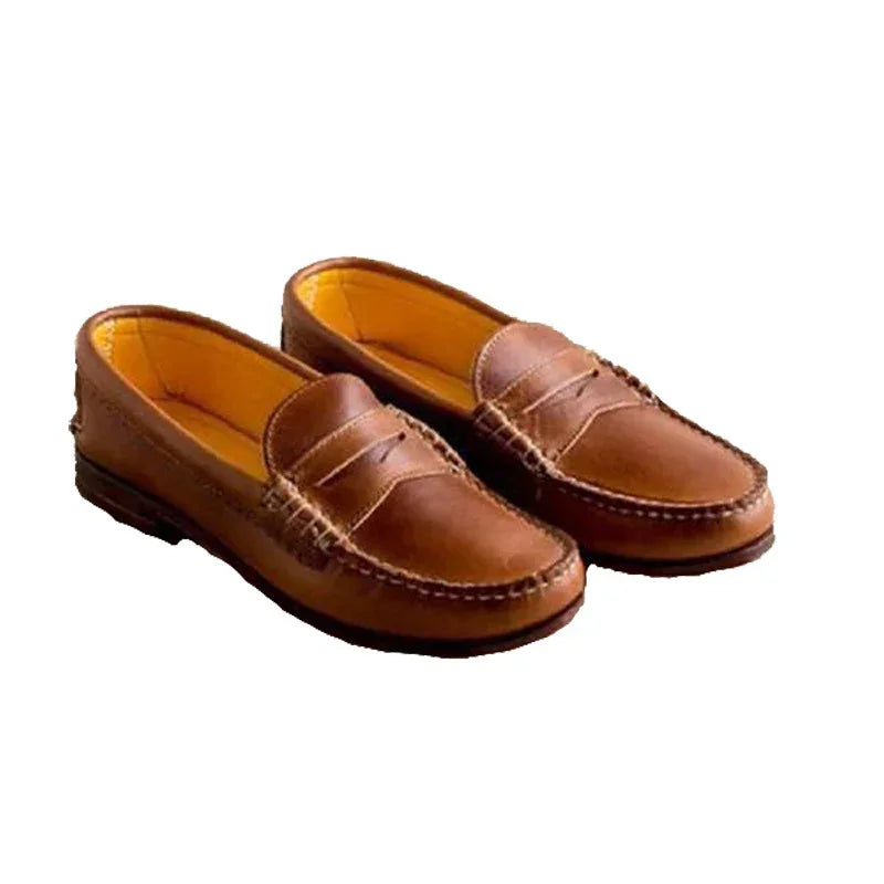 Pair of brown leather penny loafers with detailed stitching and tan interior lining on white background