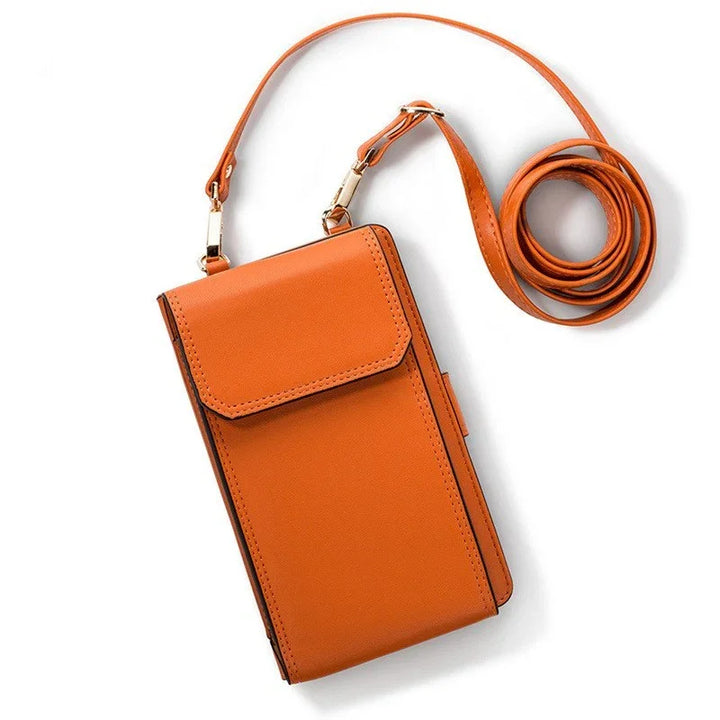 Compact orange leather crossbody wallet with adjustable strap on white background