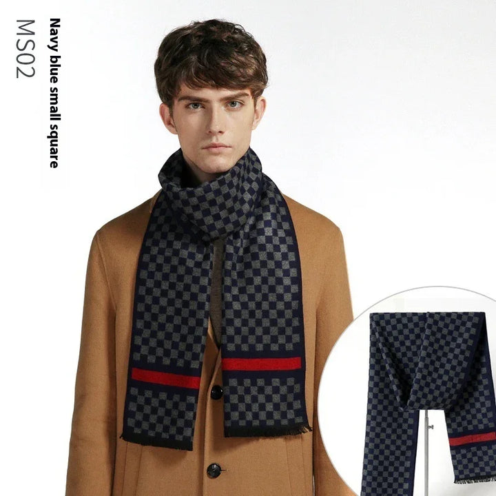 Man wearing navy blue small square checkered scarf with red stripe over camel coat on white background