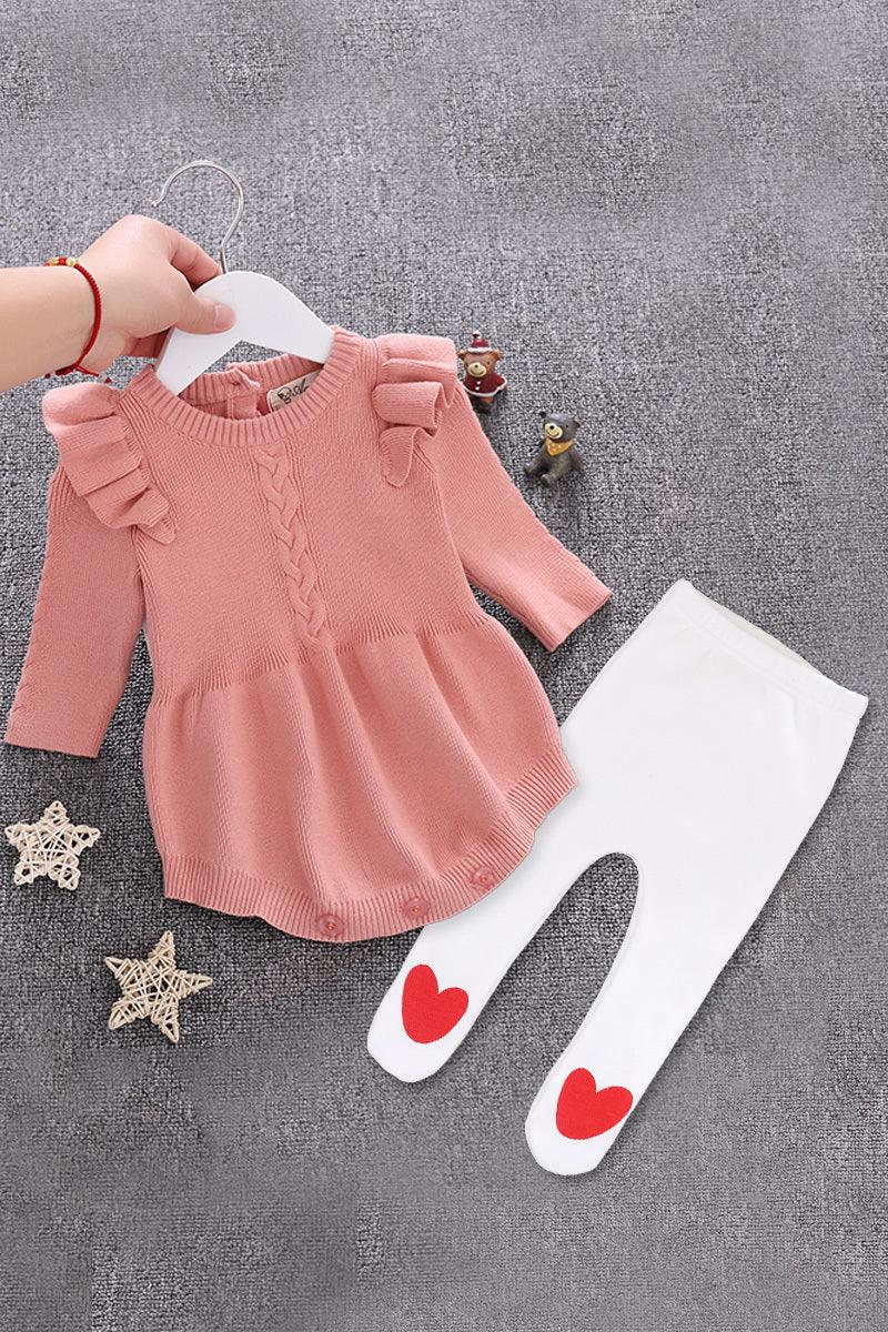 Pink knitted baby dress with ruffle sleeves and white leggings with red heart patches on knees