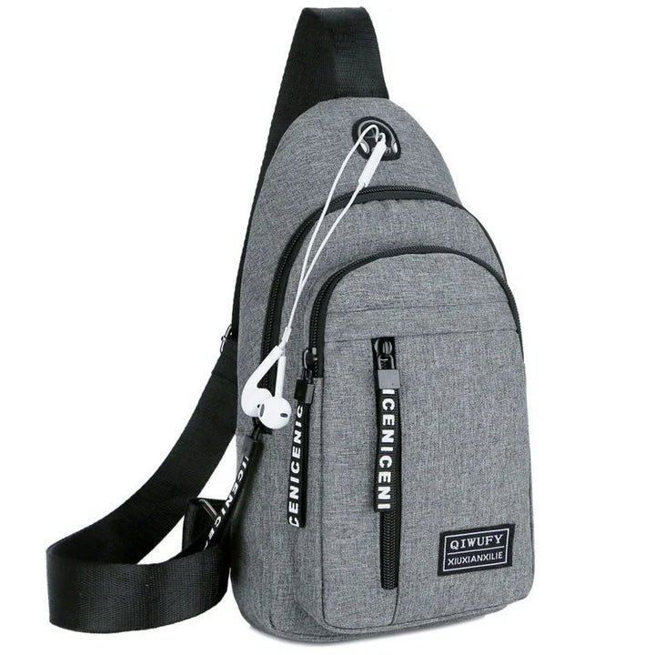 Gray crossbody sling backpack with black strap and white earphones, multiple zippered pockets