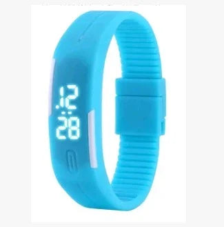 Blue digital sports wristband showing time 12:28 with adjustable silicone strap