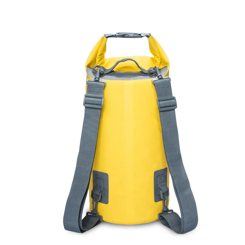 Yellow waterproof dry bag backpack with gray straps on white background