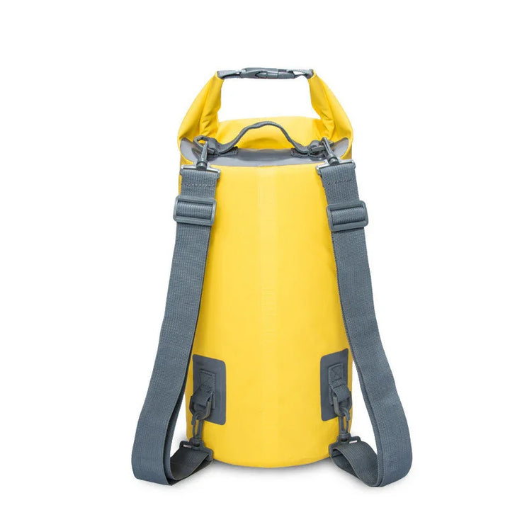 Yellow waterproof dry bag backpack with gray straps on white background