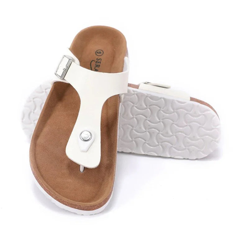 White leather thong sandals with brown cushioned footbed and textured white rubber sole