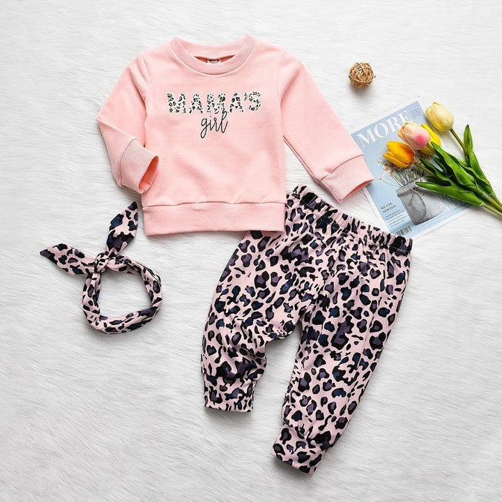 Pink toddler outfit with leopard print pants, matching headband, and sweatshirt reading MAMA'S girl