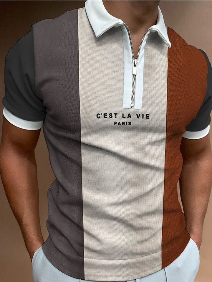 Men's short sleeve polo shirt with vertical stripes in gray, beige, and brown, featuring a white collar and zipper, and text C'est La Vie Paris