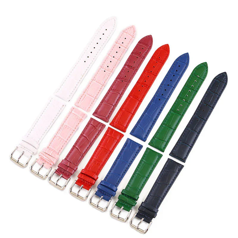 Set of colorful leather watch straps in white, pink, burgundy, red, blue, green, and black with silver buckles