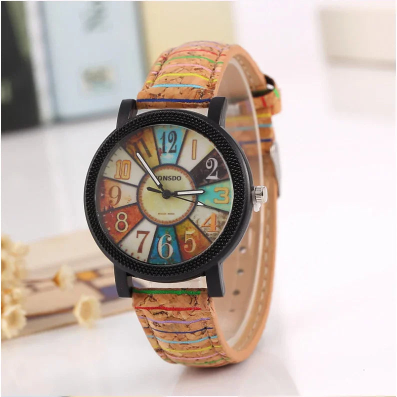 Colorful vintage-style wristwatch with multicolor numbers and striped cork leather strap