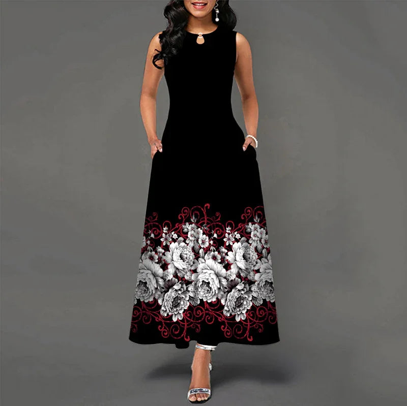 Woman wearing black sleeveless maxi dress with white and red floral embroidery at hem