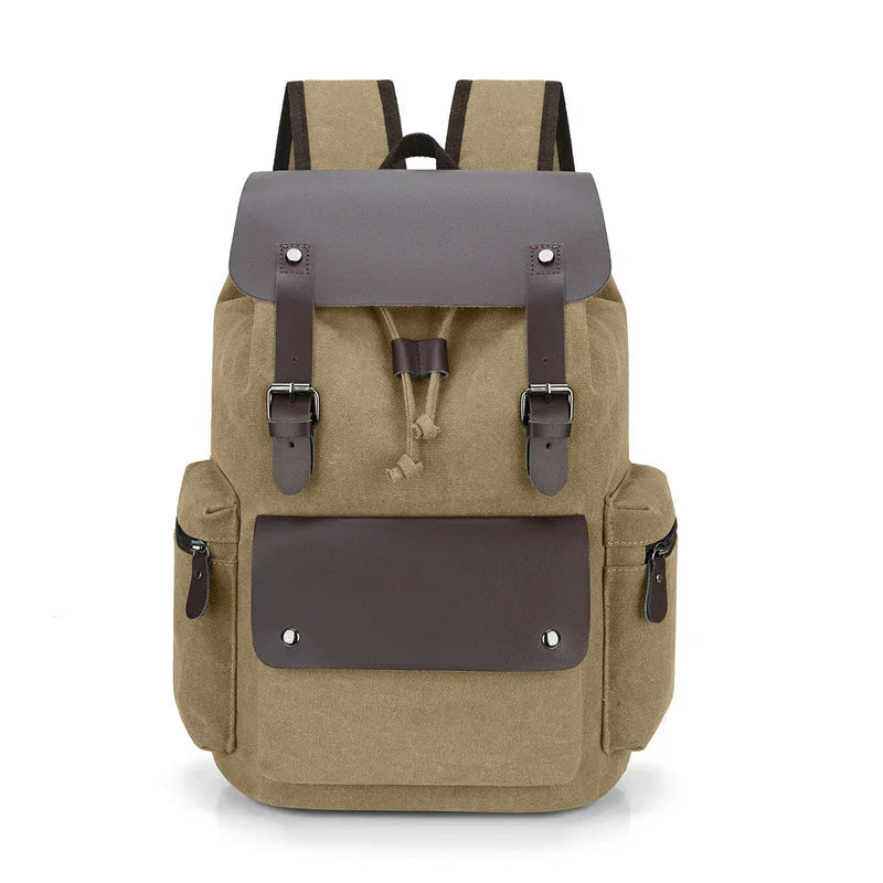 tan canvas backpack with dark brown leather flap and front pocket, side zippered compartments