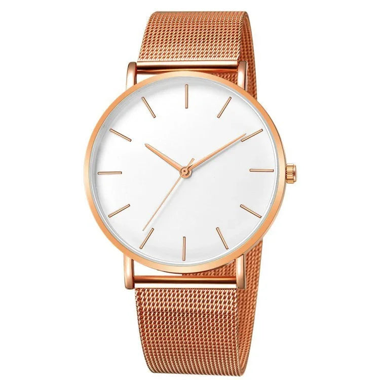 Minimalist rose gold wristwatch with white dial and mesh band
