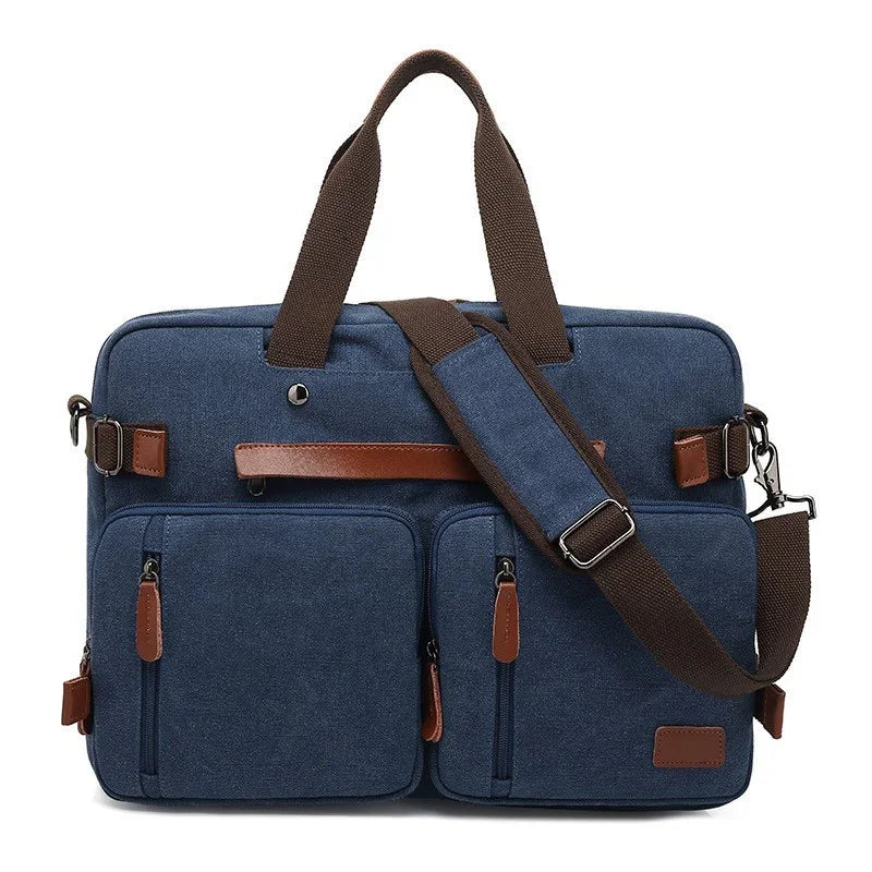 Blue canvas messenger bag with brown leather accents, dual front pockets, and adjustable shoulder strap